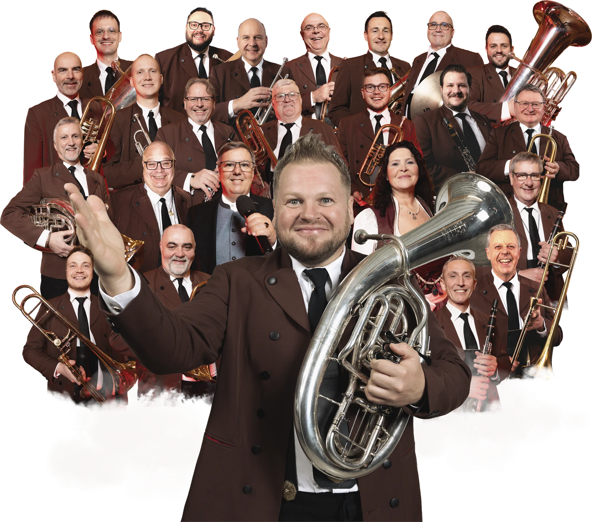 Alexander Wurz und die Egerländer Musikanten in brauner Tracht mit ihren Instrumenten